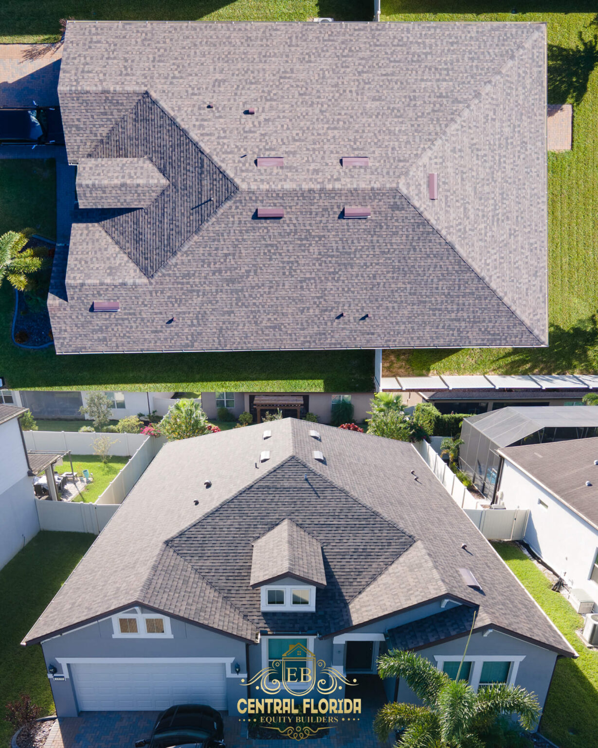 Aerial view of a newly installed shingle roof on a residential home, showcasing quality craftsmanship and design, with the logo of Central Florida Equity Builders prominently displayed.